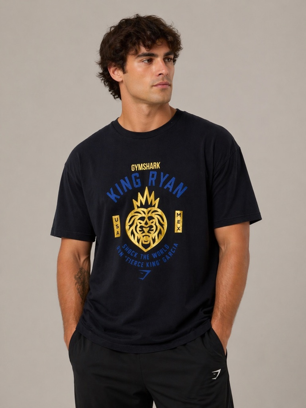 Gymshark Black King Ryan Graphic Tee with Gold and Blue Logo